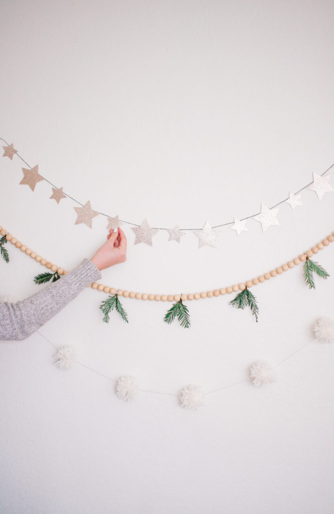 3 Easy DIY Christmas Garlands Under $5. Star garland. Evergreen wood bead garland. Pom Pom Garland