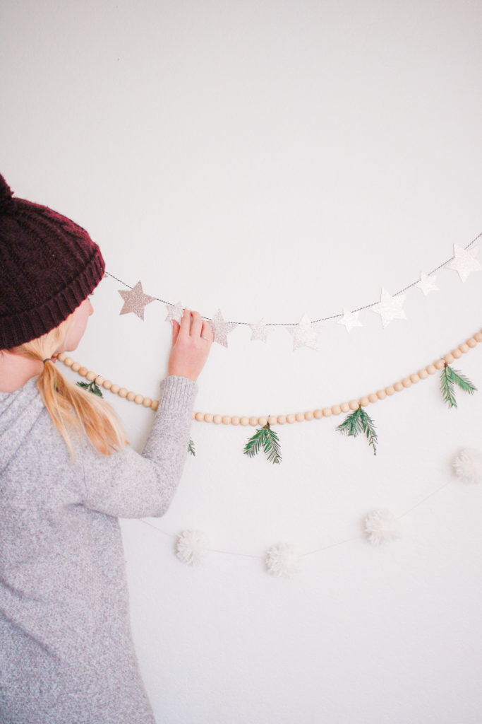 3 Easy DIY Christmas Garlands Under $5. Star garland. Evergreen wood bead garland. Pom Pom Garland