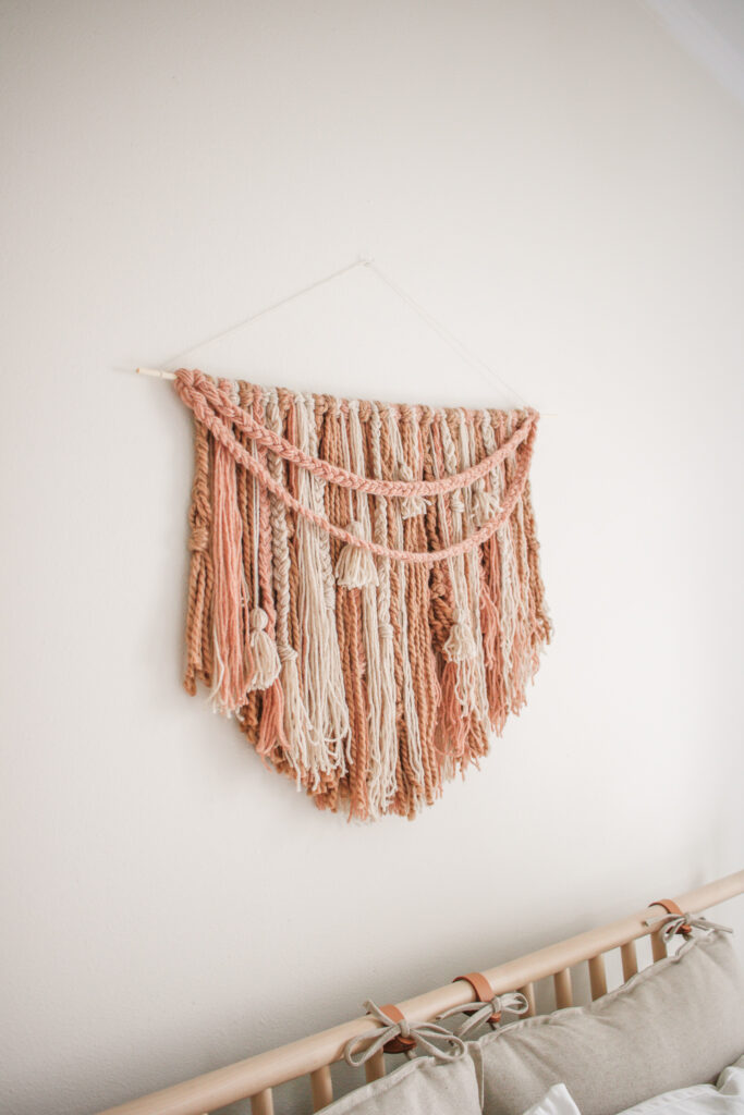 DIY Large Braided Yarn Boho Wall Hanging - The perfect addition to your home decor! So easy and simple to make. Plus no weaving!