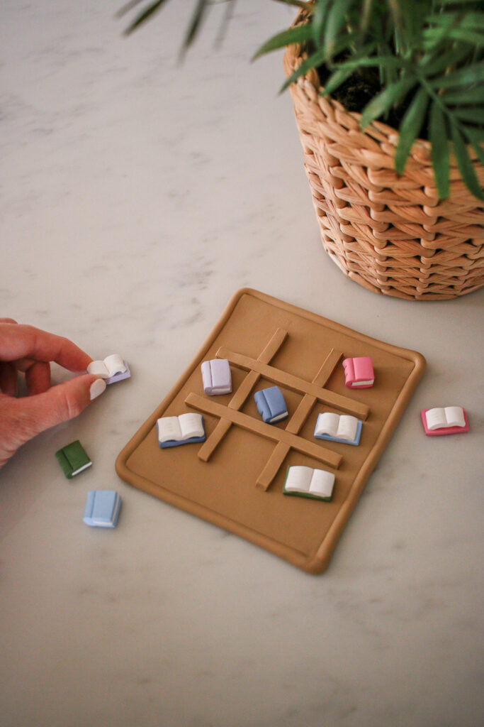 DIY Clay Book Tic Tac Toe Game made of oven bake clay. A table-top game for book lovers. The perfect easy DIY for girls night.